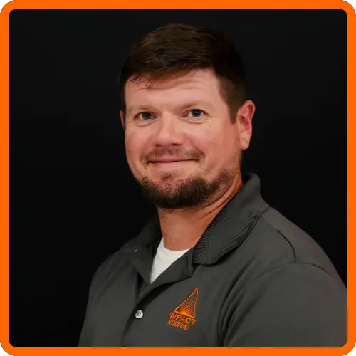 Nick Ellis headshot wearing IMPACT branded gray polo