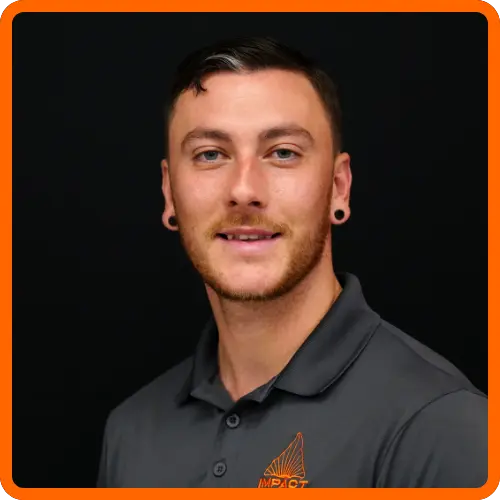 Nic Bouressa headshot wearing IMPACT branded gray polo